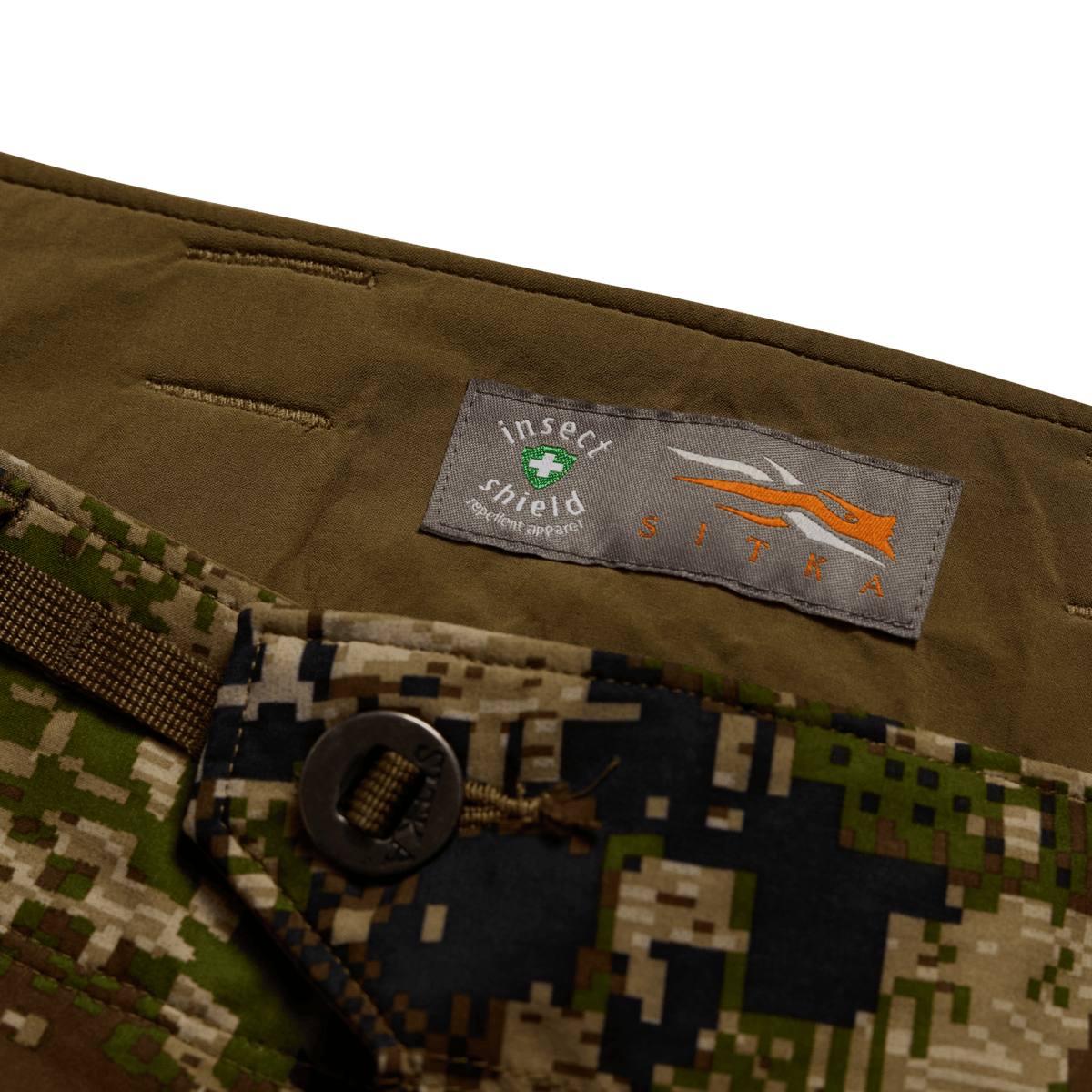 Insect Shield pocket patch on camo hunting pants, with dark webbing tab
