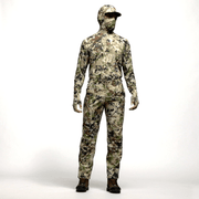 Men’s camouflage hunting pants worn with hiking boots, full-body view