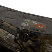 Hunting pants fabric close-up with insect shield label and dark snap