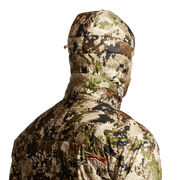 SITKA camouflage hooded jacket, side-back view with hood and raised collar.
