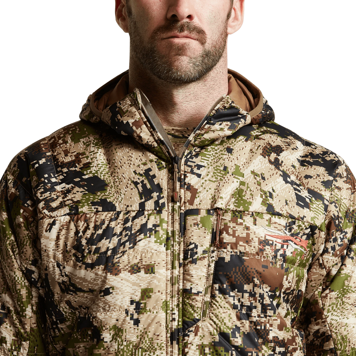 SITKA camouflage hooded jacket close-up, full-zip front and chest patch pocket.
