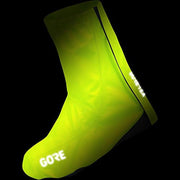 Neon cycling shoe covers with GORE lettering on the toe and Gore-TEX panel