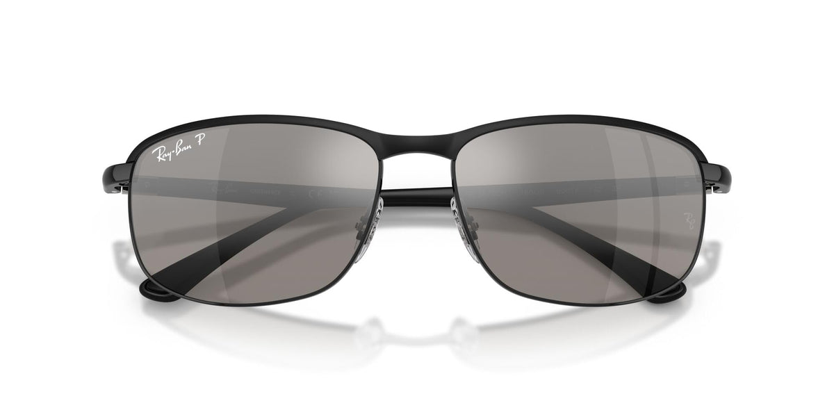 Black sunglasses with dark grey lenses and metal bridge detail