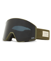 Black snow goggles with dark lens, gold frame, and olive fabric strap