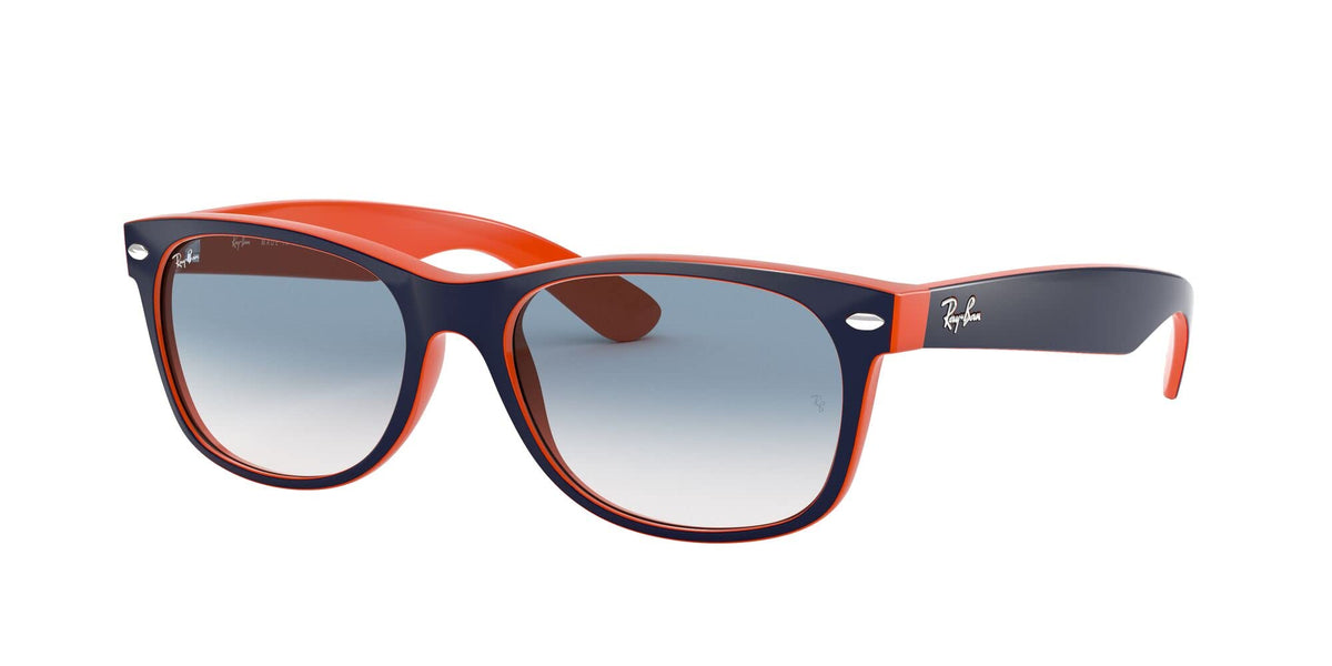 Ray-Ban Wayfarer sunglasses with orange frame, dark gradient lenses, navy logo temple.