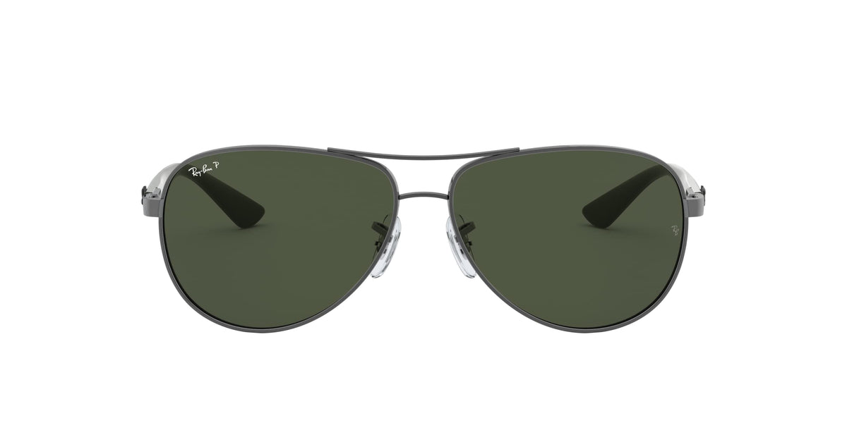 Aviator sunglasses front view, dark green lenses with slim silver bridge