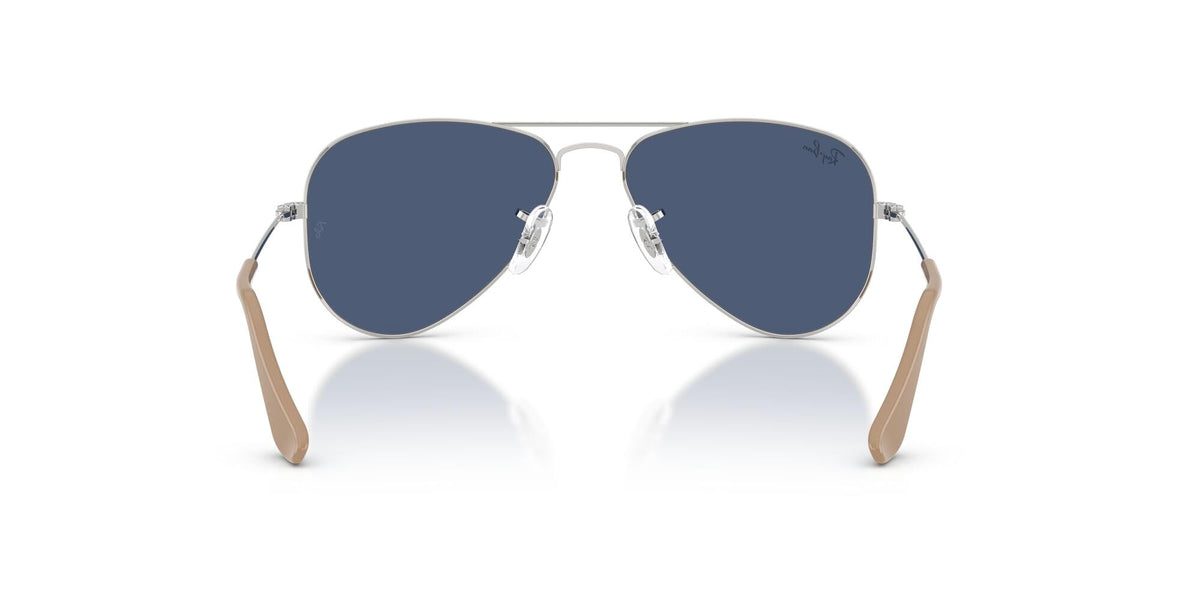 Ray-Ban aviator sunglasses with dark blue lenses and silver frame, angled front view