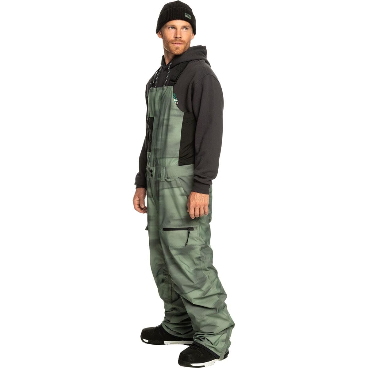 Men's snowboard bib pants, camo green with black hooded overlay and side pocket