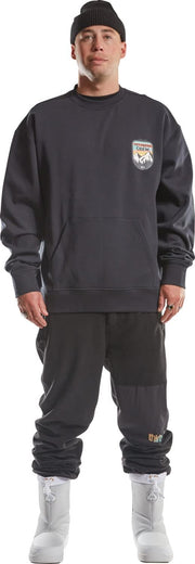 Men's black crewneck sweatshirt with chest logo patch and ribbed cuffs