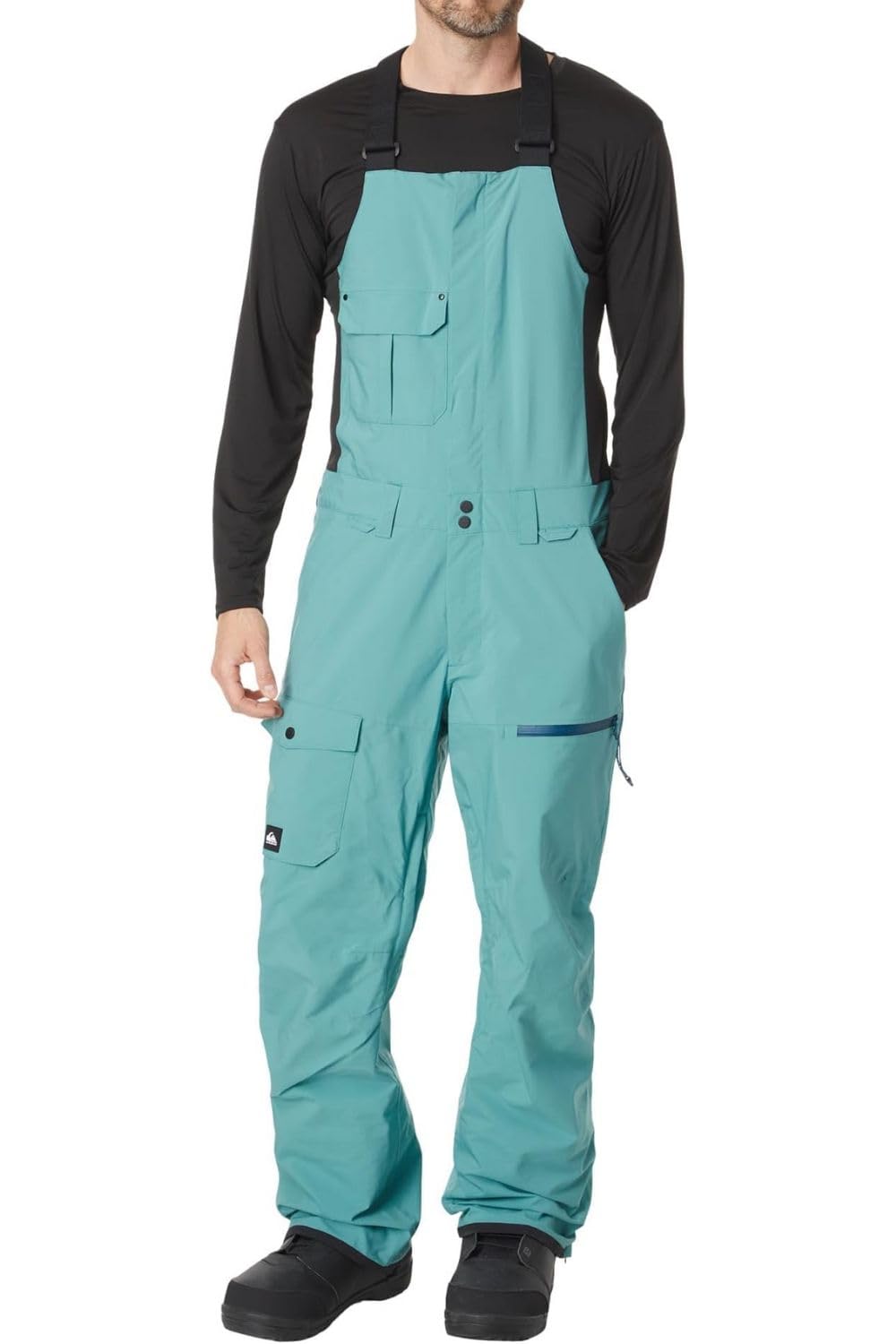Men's snowboard bib pants in teal with black sleeves and front storage pockets