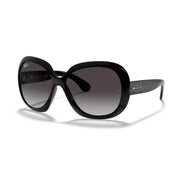 Black oversized sunglasses with dark gradient lenses and glossy curved frames