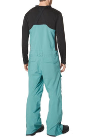 Men's snowboard bib pants back view, teal overalls with black back panel