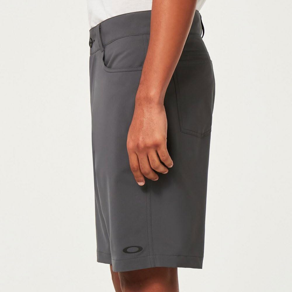 Oakley hybrid 21-inch shorts in dark grey, side view with curved front pocket
