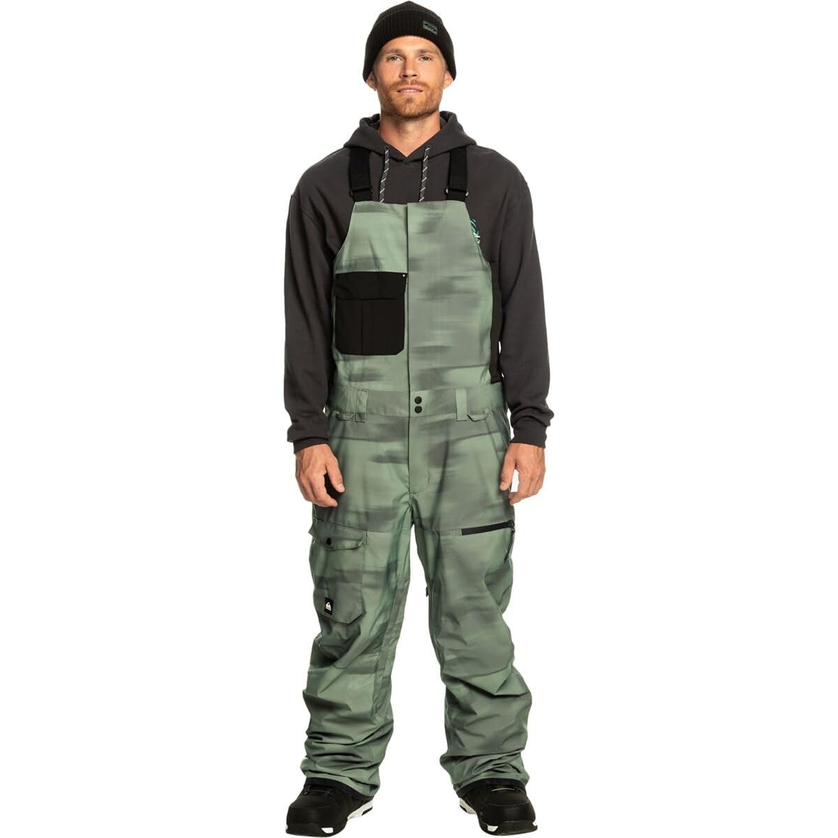 Men's snowboard bib pants, camo green with black panels and cargo pockets