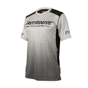 Men's short-sleeve cycling jersey in light gray/white with black shoulder panels and FASTHOUSE logo