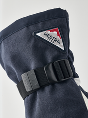 Powder gauntlet gloves in dark navy with black wrist strap and logo patch