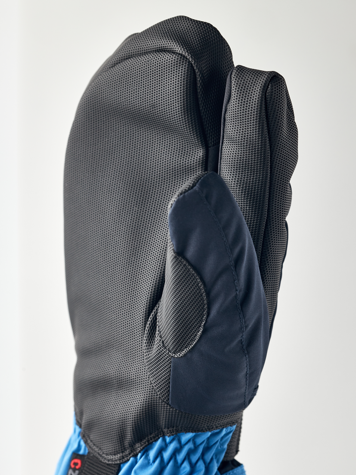 Kids grey gloves with dark blue palm patch and padded 3-finger design