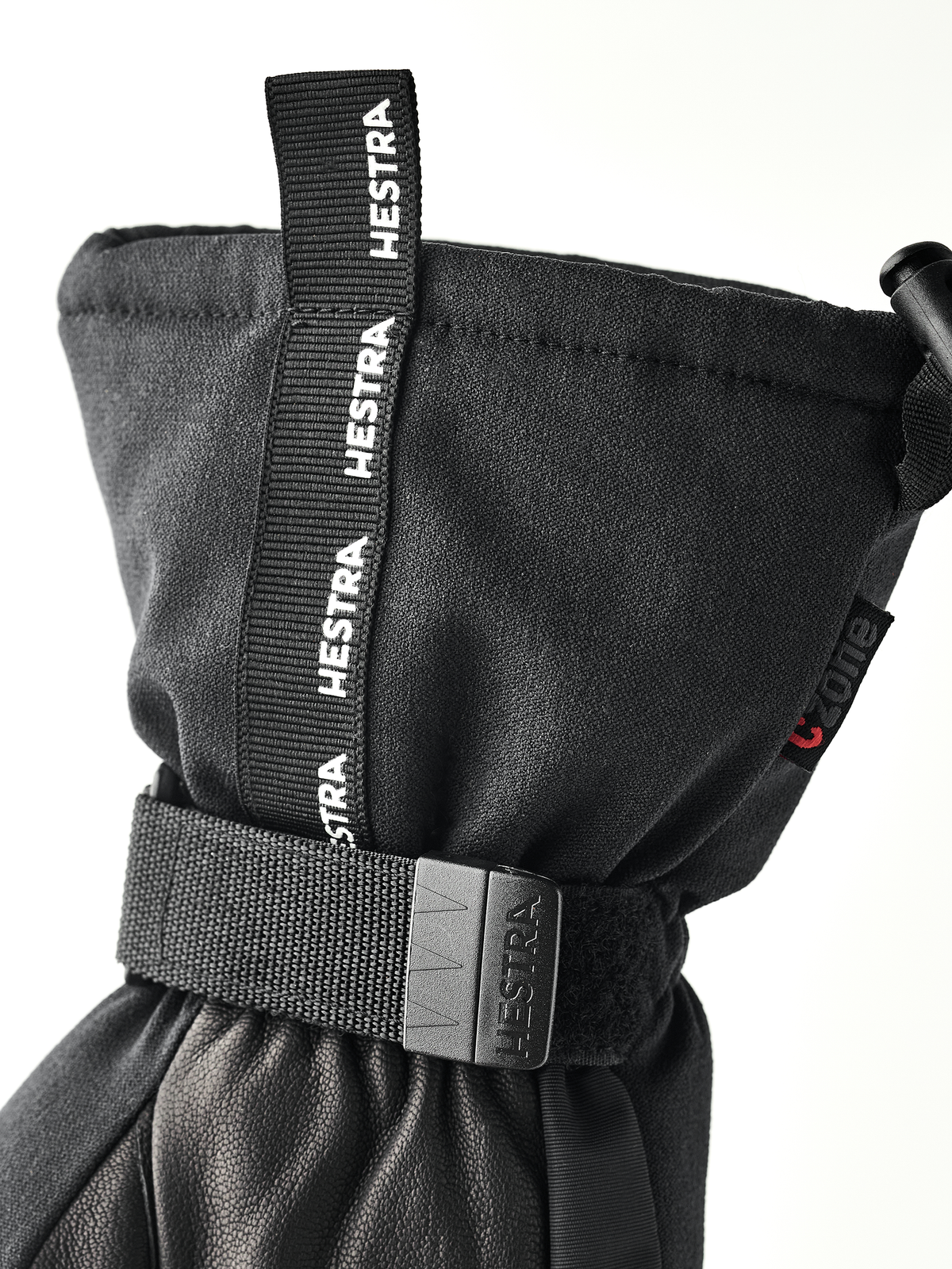 Black mountain mittens with wrist strap and HESTRA branding label