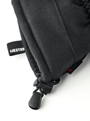 Black mountain mittens with HESTRA logo strap and pull cord detail