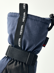 Navy mountain mittens with black wrist strap and HESTRA branding webbing