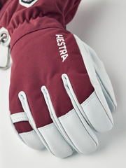 Burgundy ski gloves with light blue leather palms and white contrast seams
