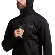 Black zip hooded jacket close-up with chest logo, drawcord, and pocket