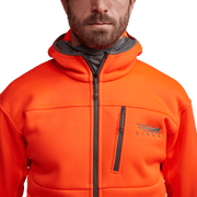 Orange zip-up hoodie close-up with front zipper and chest pocket