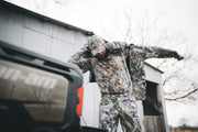 Traverse hoodie in pixel camouflage with hood and full-zip, worn outdoors