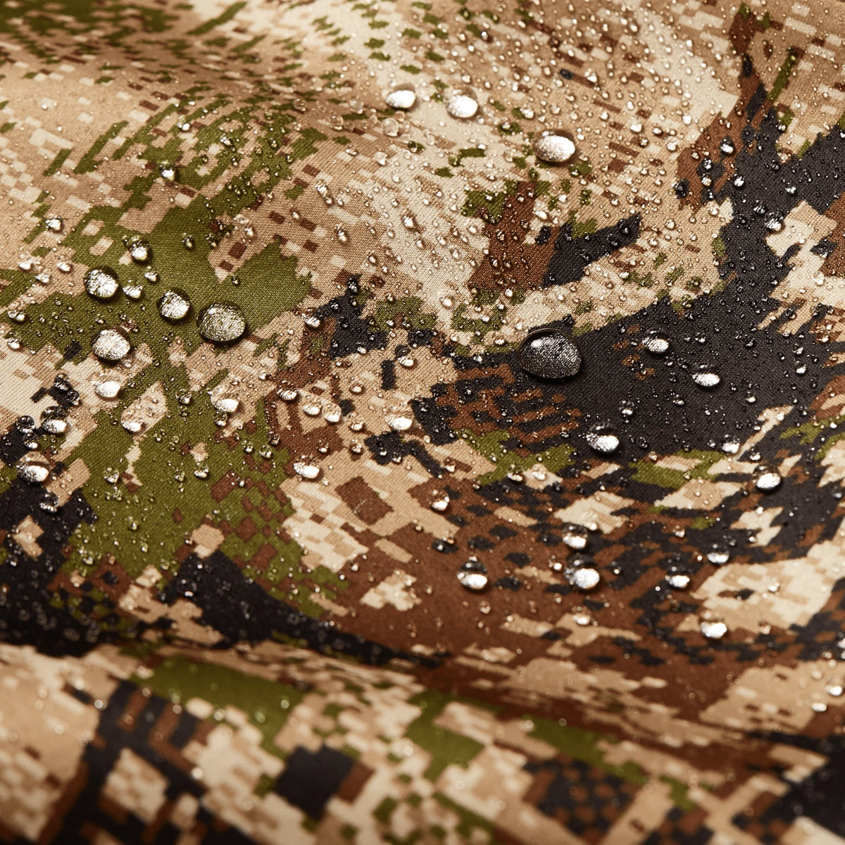 Camouflage hoodie fabric close-up with water droplets on textured pattern