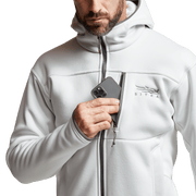 White zip-front hoodie with SITKA logo on chest and pocket zippers