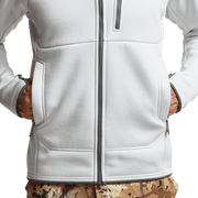 White zip hoodie front close-up with pockets and hem panel seams