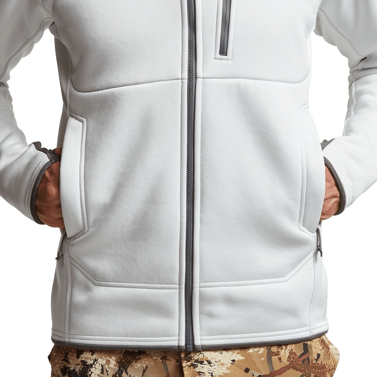 White zip hoodie front close-up with pockets and hem panel seams