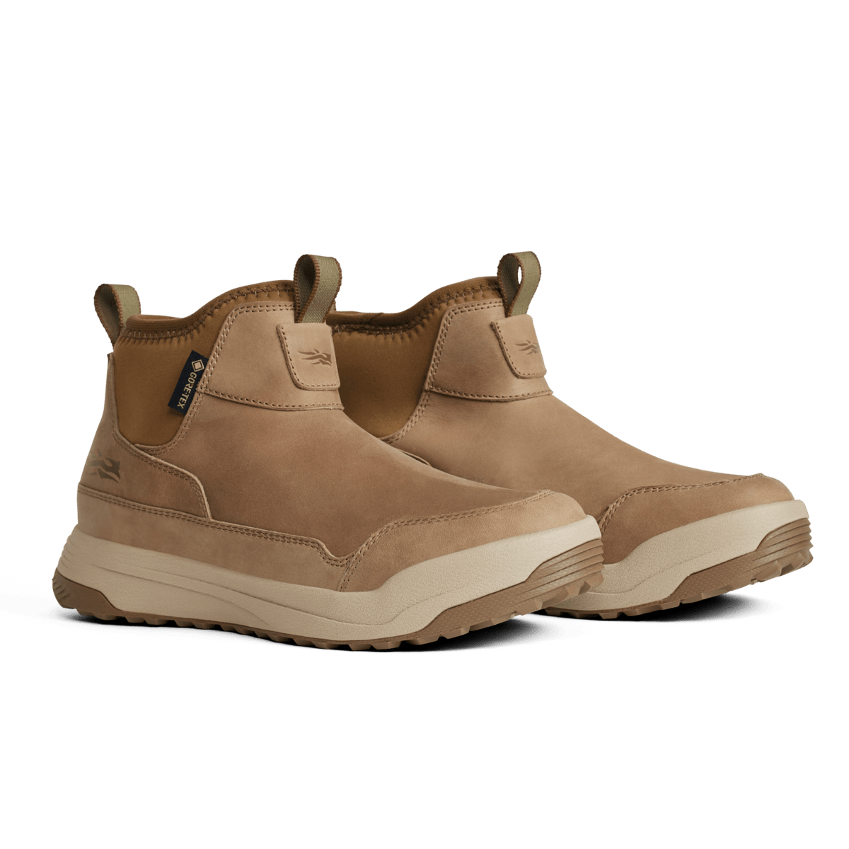 Tan suede ankle boots with padded collar, elastic side, and thick rubber sole