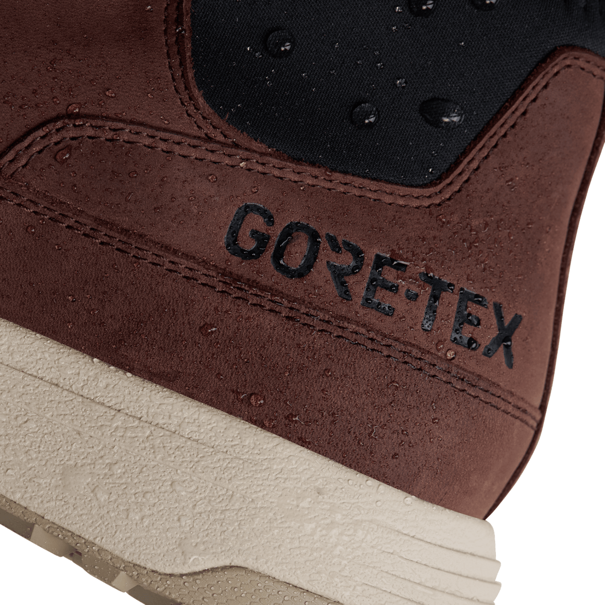 GoTex logo on brown suede boot shaft with stitched seams and textured outsole