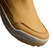 Tan suede boot toe and side seam with contrast stitching and grippy textured sole