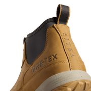 Golden suede ankle boot side detail with GORE-TEX text and dark collar