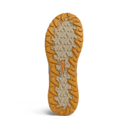 Outdoor outsole view of suede ankle boot with rugged tread and rubber lugs