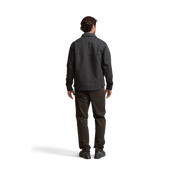 Dark chore coat back view with yoke detail and long sleeves, buttoned front.