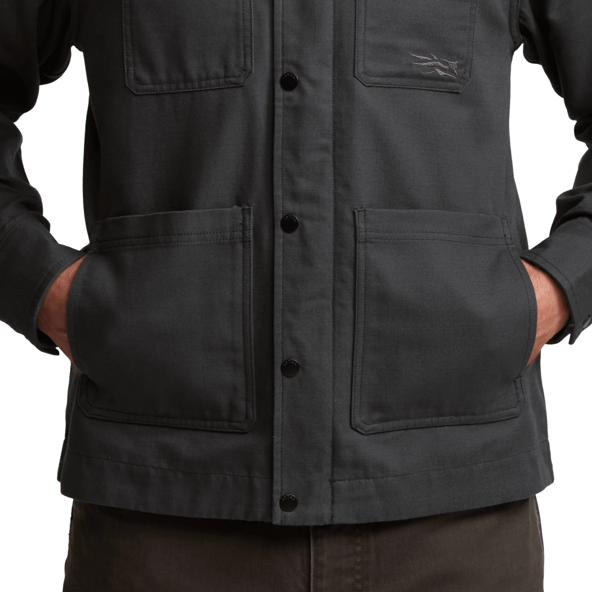 Men’s obsidian-black chore coat close-up of button placket and utility pockets