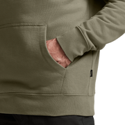 Light tan hoodie sleeve and kangaroo pocket seam detail