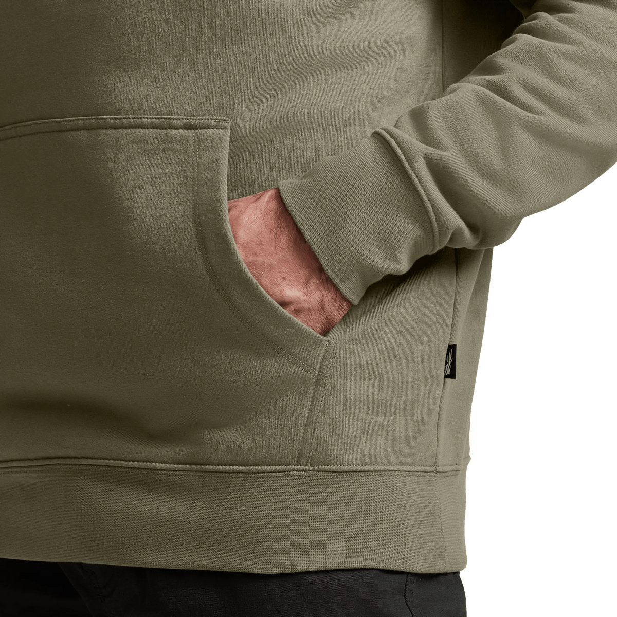 Light tan hoodie sleeve and kangaroo pocket seam detail