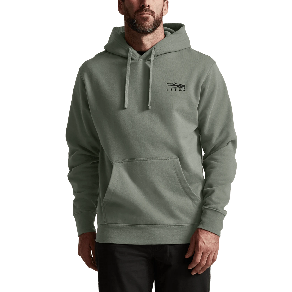 Sage green pullover hoodie with hood, drawstring, and kangaroo pocket on model