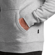 Heather gray hoodie close-up of front pouch pocket and sleeve hem