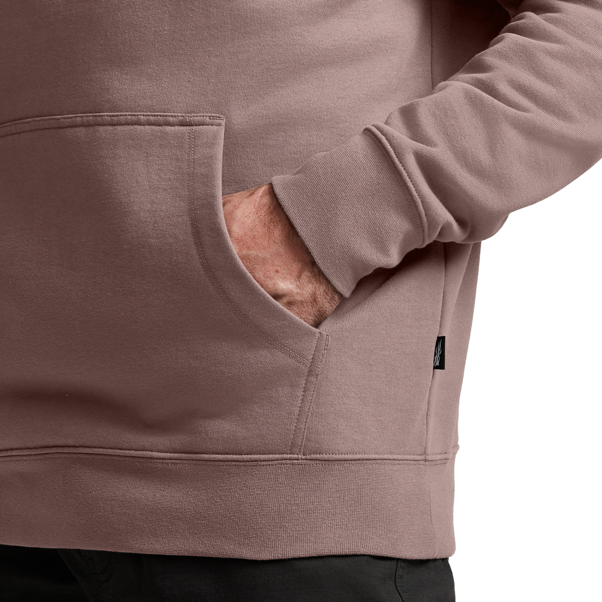 Taupe hoodie close-up of kangaroo pocket and sleeve; drawcord ends, Sitka branding