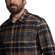 Close-up of lightweight flannel shirt in dark plaid with button collar and chest pocket