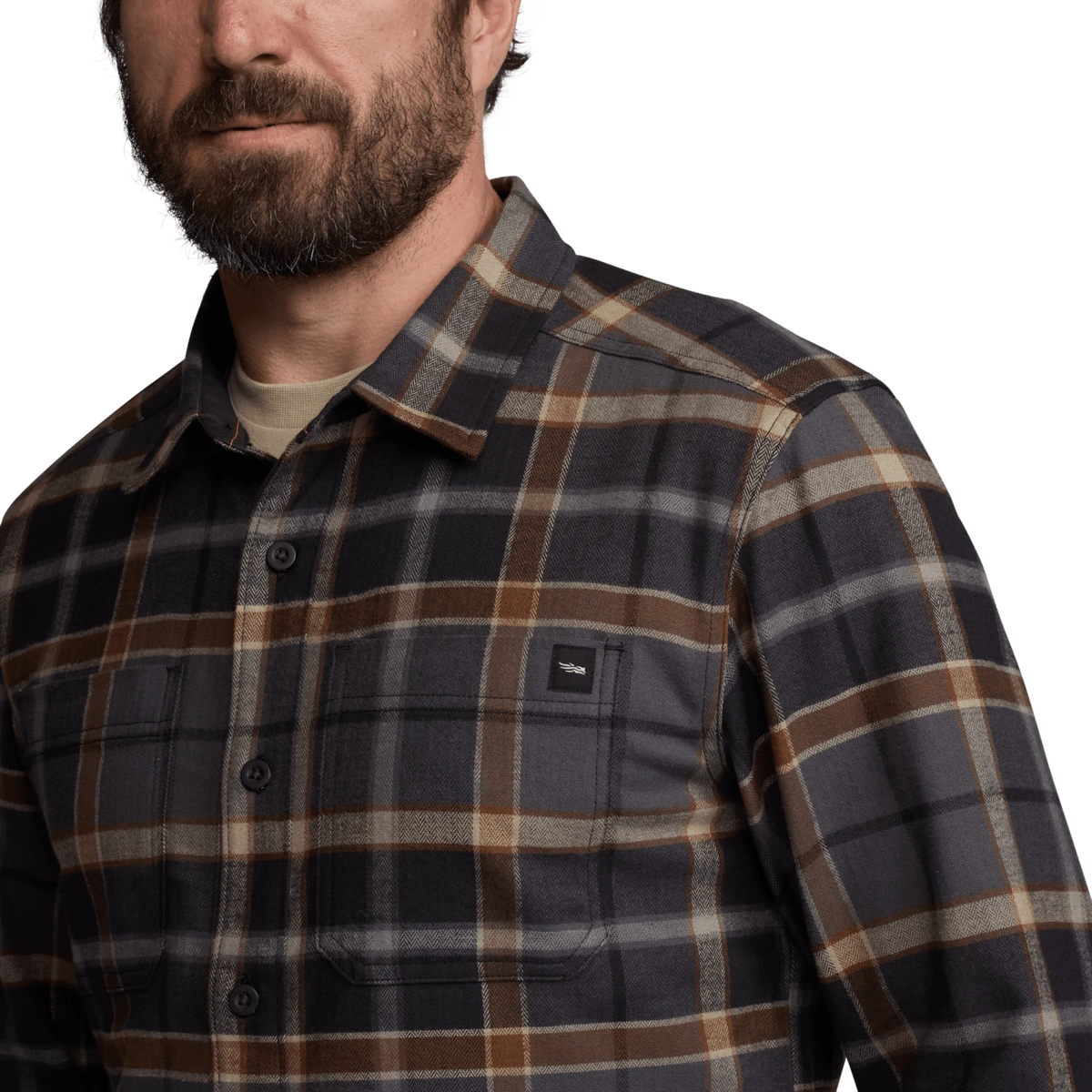 Close-up of lightweight flannel shirt in dark plaid with button collar and chest pocket
