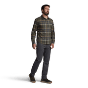 Men’s lightweight flannel plaid shirt in dark green and tan, worn with dark gray pants