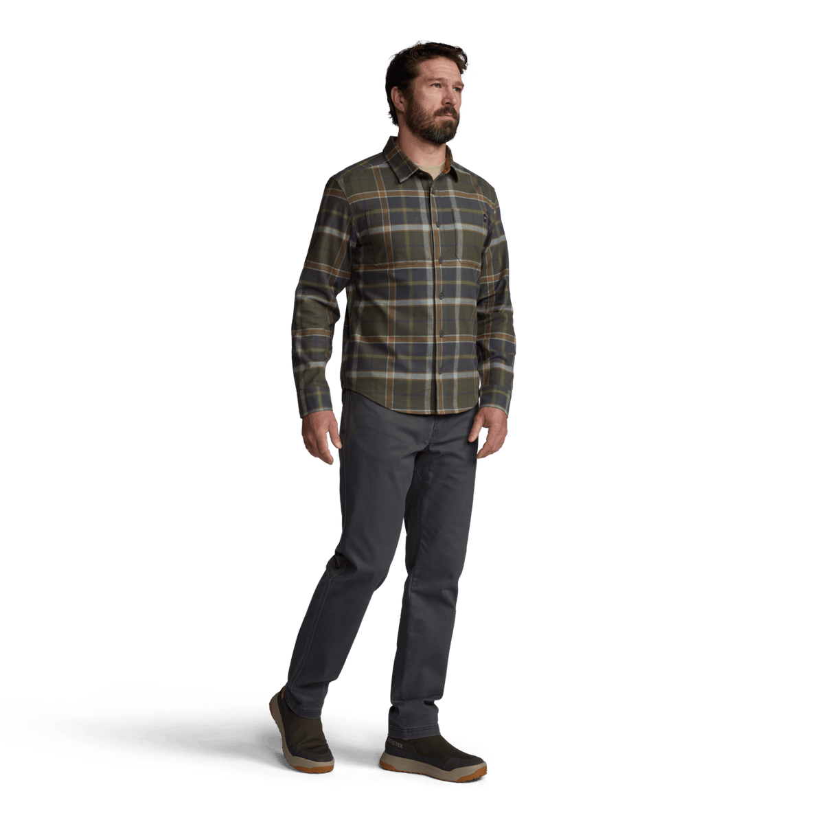 Men’s lightweight flannel plaid shirt in dark green and tan, worn with dark gray pants