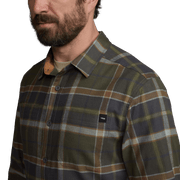 Lightweight plaid flannel shirt close-up, olive/gray plaid, button-front, chest pocket