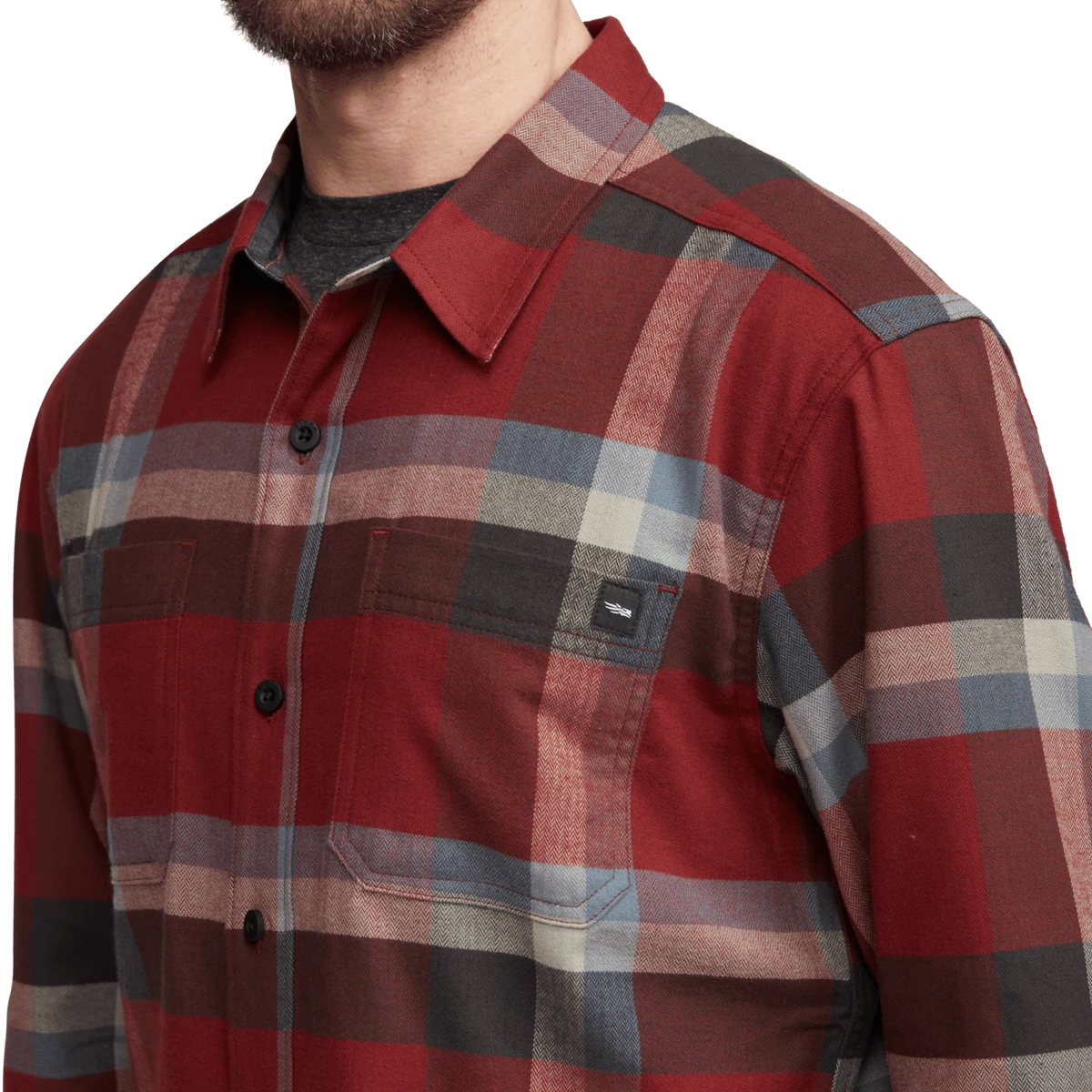 Close-up of lightweight flannel plaid shirt in burgundy, gray, and tan with button-down collar